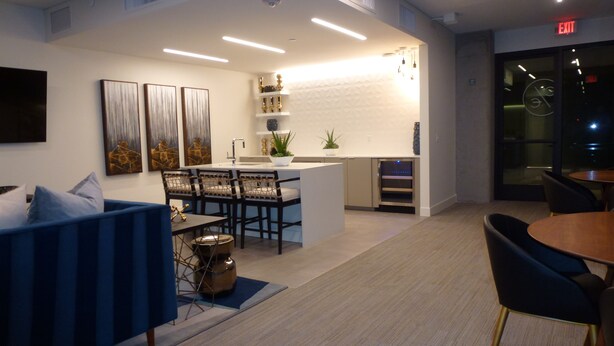 A modern interior with a dining area, kitchen, and seating space. - New beautiful 2 Bedroom Unit in Biltmore District Walk to Shopping Restaurants (Phoenix)