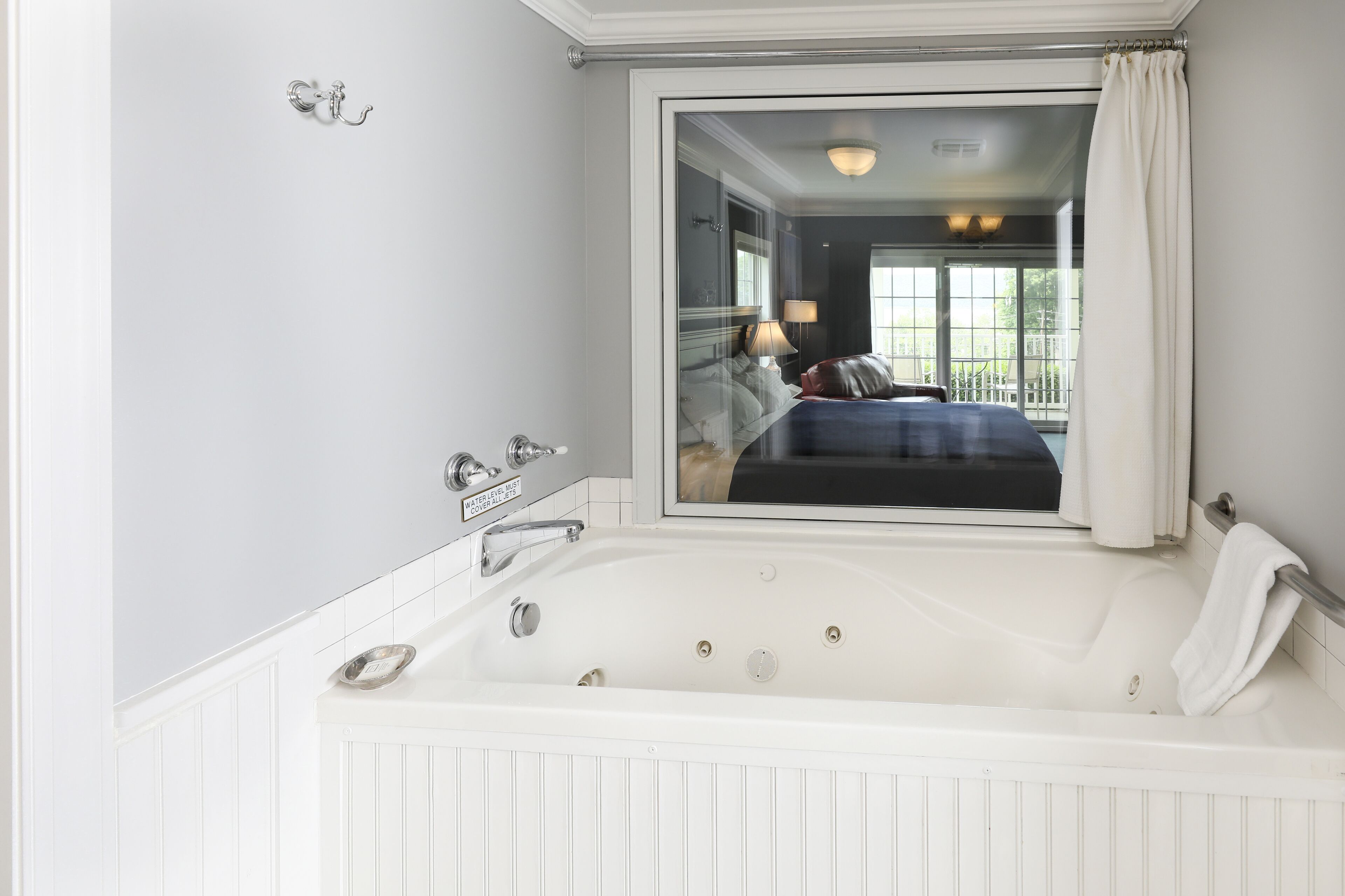 lakeview spa room | bathroom | designer toiletries, hair dryer, towels, soap