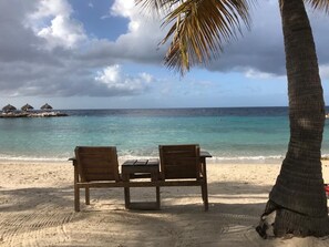 On the beach, sun loungers, beach towels