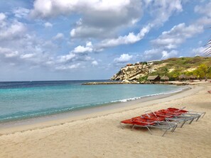 On the beach, sun loungers, beach towels