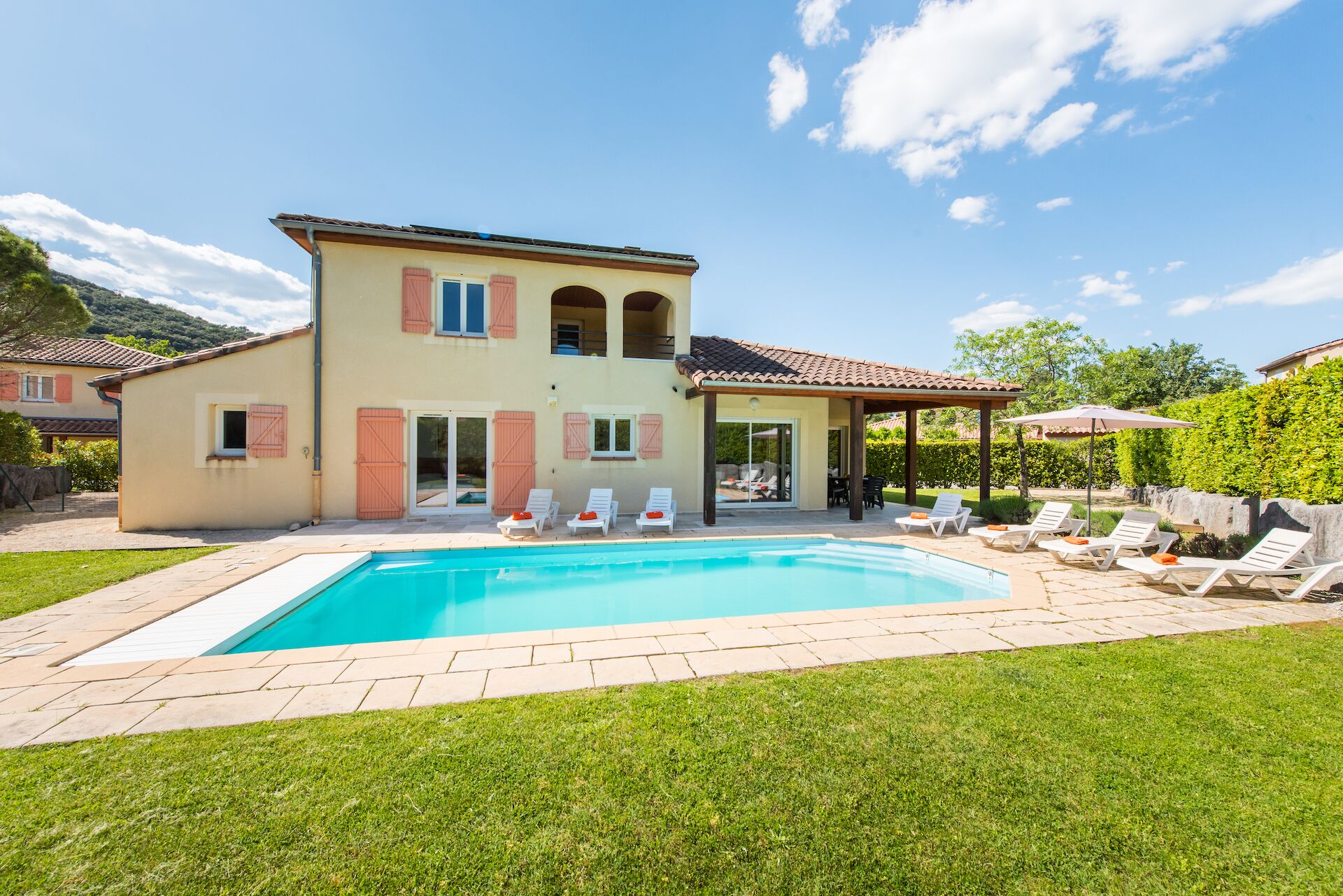 A heated pool, pool loungers