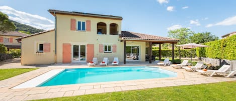 A heated pool, pool loungers