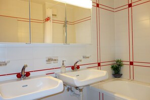 Combined shower/tub, hair dryer, towels, soap