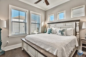 A bedroom with a large bed, a ceiling fan, and multiple windows with blinds. - ☀️ Silver Sands | Golf Cart | Heated Pool* | Game Room | FREE Tiki Cruise + More (Miramar Beach)