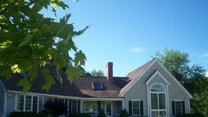 A two-story house with a front porch, a chimney, and a large arched window. - Cool off in the Sunday River! Kayak to the Androscoggin. Spacious  Bethel home (Bethel)