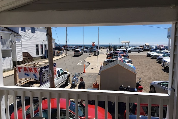 Your view from private covered front porch, directly across from the sandy beach