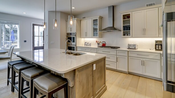A modern kitchen with a large island, stainless steel appliances, and white cabinetry. - 16 Bittern-3rd Row (85 yards) to the Ocean, Lowcountry home w/ private pool. (Hilton Head Island)