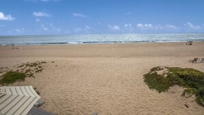 A beach with a clear sky, a sandy shore, and a few beach chairs. - Seahorse Retreat - Double The Fun, BEACHFRONT, In Carpinteria! (Carpinteria)