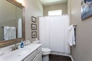 Combined shower/bathtub, hair dryer, towels, soap