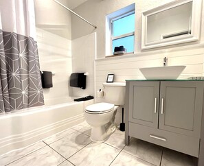 Combined shower/tub, hair dryer, towels, soap