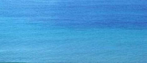 On the beach, sun-loungers