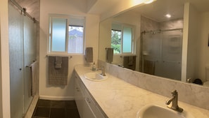 Combined shower/tub, hair dryer, towels, soap