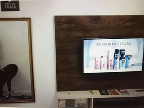 A television displaying an advertisement for a skincare product.
