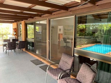 Outdoor dining. Cranley Garden Retreat with Fireplace & Pool