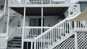 A multi-level wooden structure with a balcony and stairs. - A Stone Throw Away from the Beach (Wildwood)