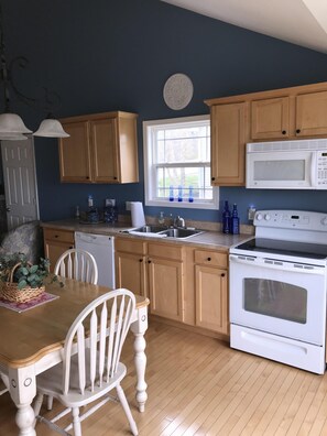 Microwave, dishwasher, coffee/tea maker, cookware/dishes/utensils