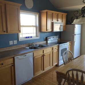 Microwave, dishwasher, coffee/tea maker, cookware/dishes/utensils