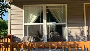 A wooden porch with a sign reading 'COTTAGE 4' and a window with curtains. - Lakeside Haven, Cottage#4, Pool, Hot Tub, Lake View (Taylorsville)
