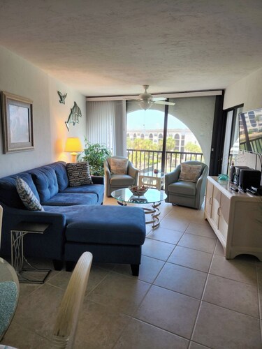 Modern top floor with a beautiful view of the bay, pool, waterfront restaurant