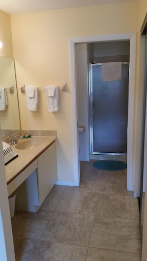 Combined shower/tub, hair dryer, towels, soap