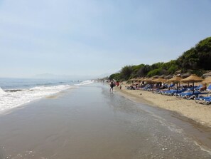 On the beach, sun loungers