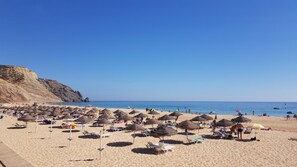 On the beach, sun-loungers