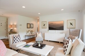 Cozy living space with a sofa, armchair, and coffee table, perfect for relaxing and socializing.