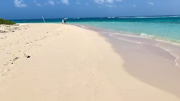 On the beach, sun loungers, beach towels