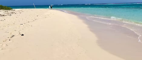 On the beach, sun loungers, beach towels