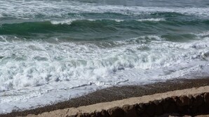 A beach with waves and a rocky shoreline. -  REMODELED OCEANFRONT HOME WITH PRIVATE POOL AND HOT TUB (Playas de Rosarito)