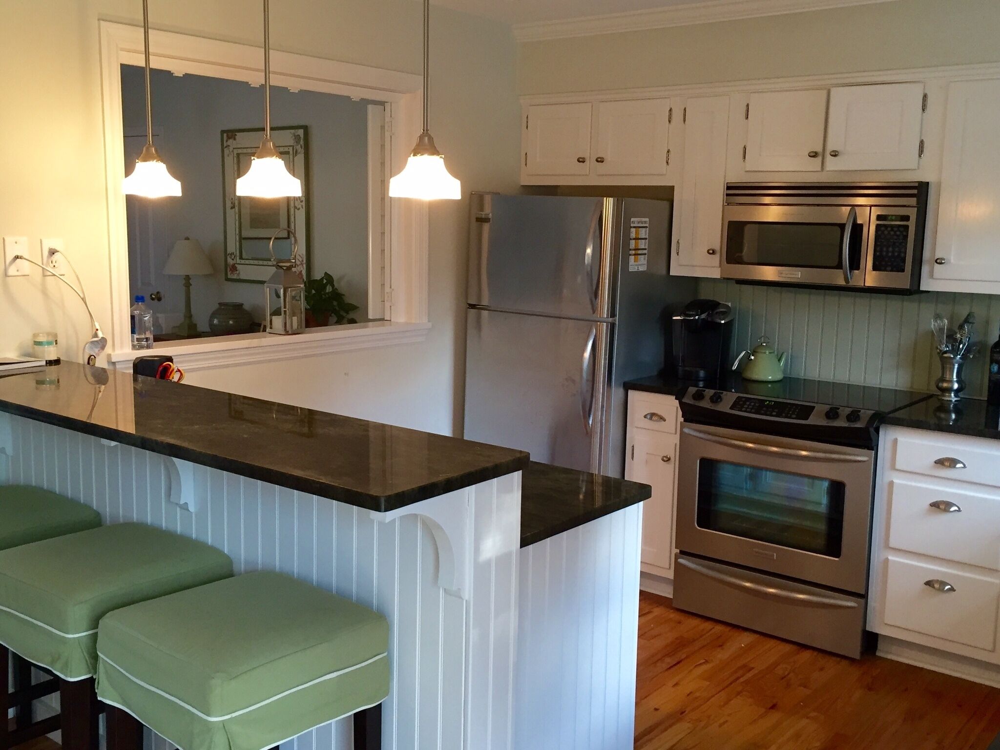 Modern kitchen with stainless steel appliances, including dishwasher.