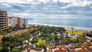 A resort with a pool, palm trees, and a beach view. - Gorgeous Ocean View- completely remodeled 2/2, Great Decor, Fireplace, King Beds (Puerto Penasco)