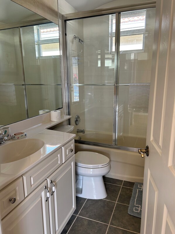 A bathroom with a glass-enclosed shower, two sinks, a toilet, and a large mirror. - Private Cabana Villa Luxury 3BR - 3BA Mustang Golf Course at Lely Resort, Naples (Naples)