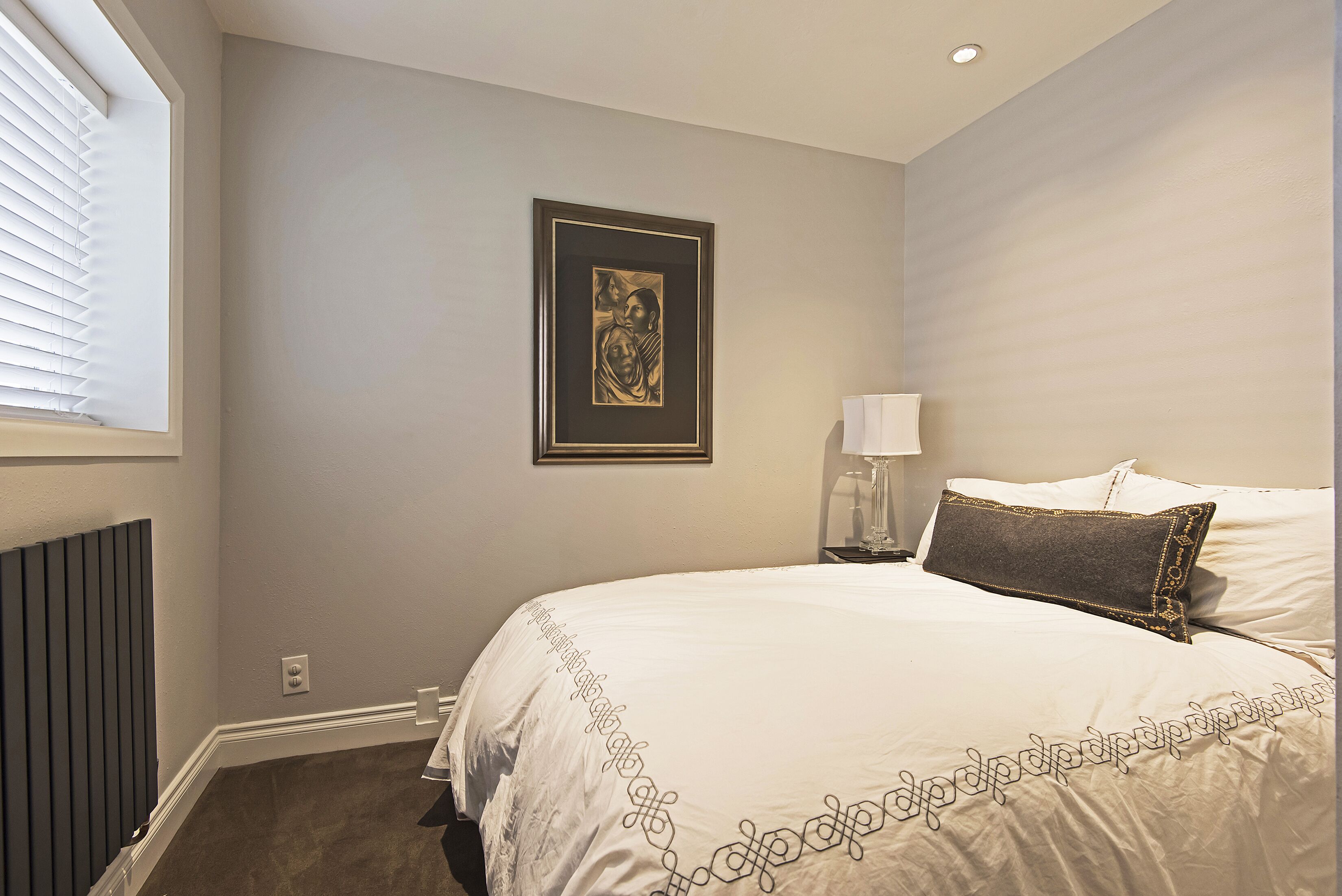 Guest bedroom with full bed. 