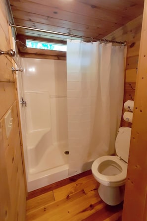Shower, hair dryer, towels, toilet paper