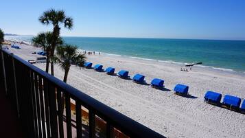 On the beach, sun loungers, beach towels