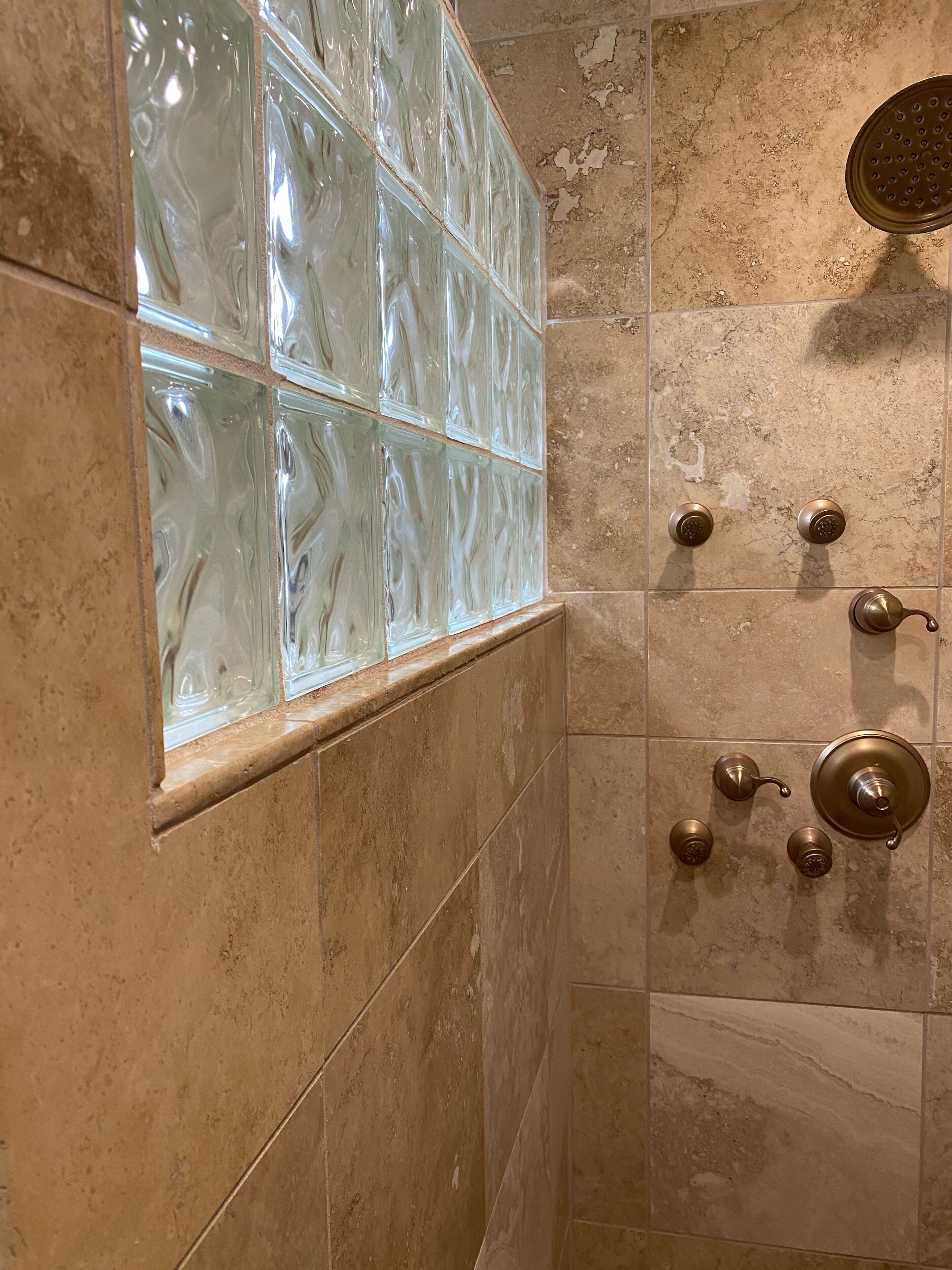 Shower, hair dryer, towels, shampoo