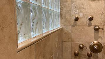 Shower, hair dryer, towels, shampoo