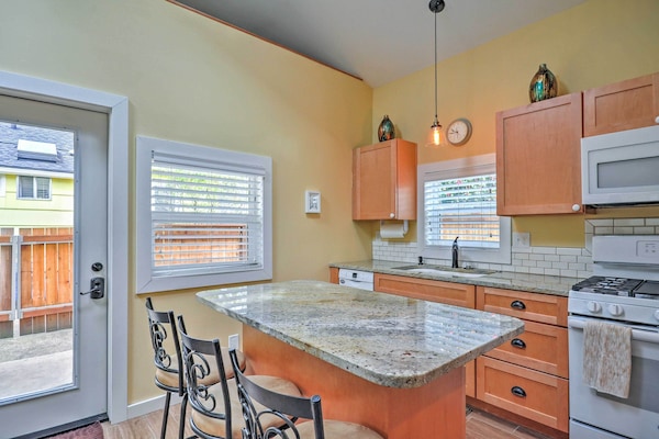 Well stocked kitchen with tile and granite countertops