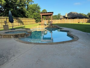 A backyard with a swimming pool, a wooden pergola, and a wooden fence. - Nice Family Fr. WalMart and HEB & Wallgreens Walking, Iron Man. 3 Nights Minimum (The Woodlands)