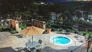 An outdoor patio with a pool, seating, and a view of the landscape. - Beach Walk to Salt Creek Beach for Surf and Sun - Air Conditioned STR15-0392 (Dana Point)