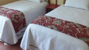 A hotel room with two beds, a wall art piece, and a red lamp. - Guest House  1Bedroom Sleeps 4 (Cocoa Beach)