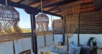 Vintage chic seaside maisonette is located on just a few meters from the beach.
