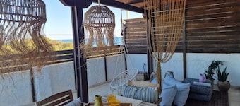 Vintage chic seaside maisonette is located on just a few meters from the beach.