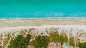 On the beach, sun loungers, beach towels