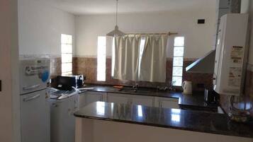 Basic Apartment, 2 Bedrooms, Balcony | Shared kitchen | Full-sized fridge, microwave, stovetop, electric kettle