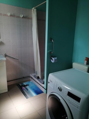 Shower, rainfall showerhead, hair dryer, towels