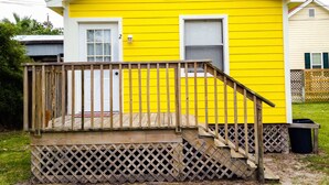 A yellow house with a wooden deck and a white door. - BayShore Lodge 123 – Yellow Cabin #2 in Port O’Connor, TX
Prop ID:7580493 (Port O'Connor)