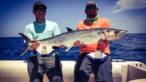 Two individuals holding a large fish on a boat with the ocean in the background. - BayShore Lodge 123 – Yellow Cabin #2 in Port O’Connor, TX
Prop ID:7580493 (Port O'Connor)
