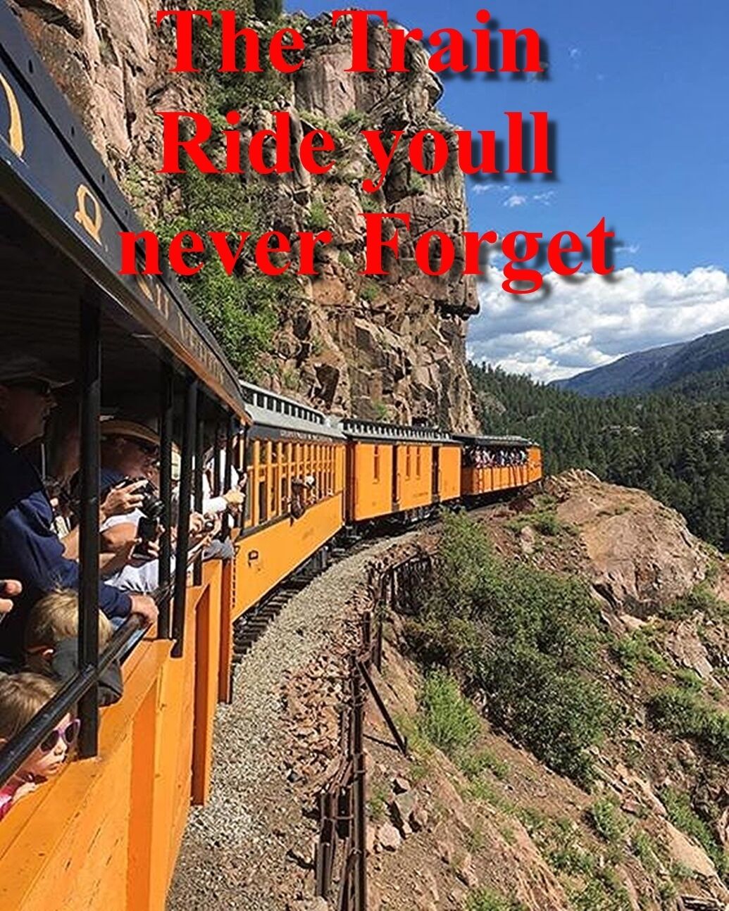 A train ride through a mountainous area with a rocky cliffside and forested hills in the background.